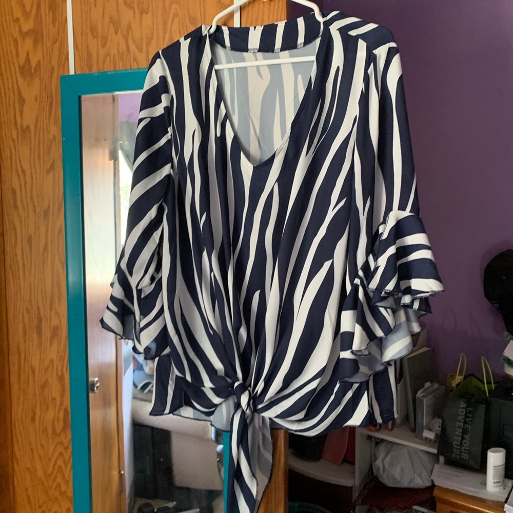 Lightweight tie front blouse, worn twice.